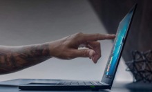 Man touching 4K touch display of Razer Blade Stealth gaming laptop