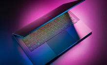 Razer Blade Stealth 13-inch gaming laptop partially closed with RGB keyboard lit up. 