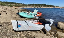 Two kayaks on a lake shore