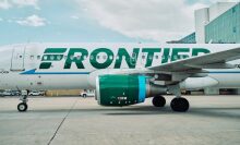 Frontier Airlines plane on ground at airport