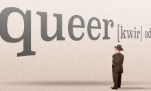 the word "queer" in big letters with a small person looking up at it