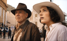 Indiana Jones (Harrison Ford) and Helena (Phoebe Waller-Bridge) stand in a street in "Indiana Jones and the Dial of Destiny"