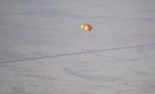 A test OSIRIS-REx sample module plummeting down to the Utah desert.