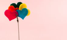 A heart-shaped ornament and a clip with several felt colored hearts