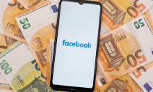 In this photo illustration a Facebook logo seen displayed on a smartphone screen on 50 and 100 Euro bills in Athens, Greece on September 30, 2023.