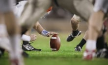 close up of place kick holder position for football