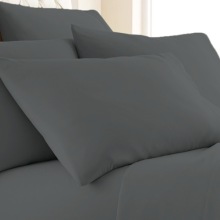 Six-Piece Bamboo-Blend Luxury Sheet Set on a bed.