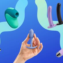blue background with various sex toys surrounding a hand holding a butt plug