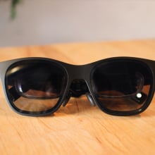 pair of tinted AR glasses with smaller lenses inside