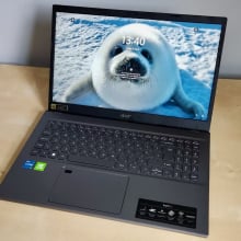 Acer Aspire 5 laptop with baby seal as desktop background