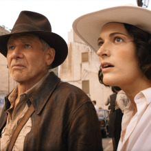 Indiana Jones (Harrison Ford) and Helena (Phoebe Waller-Bridge) stand in a street in "Indiana Jones and the Dial of Destiny"