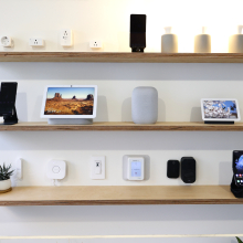 a set of shelves covered with Google Home-ready devices