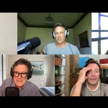 Five men in different screens wearing headphones on a video call.