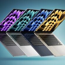 Four 15-inch MacBook Airs lined up artfully over a bluish background