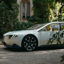 BMW Vision Neue Klasse parked in a shady drive.