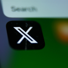 X logo on mobile device