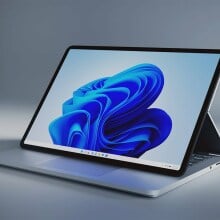 The 2021 Microsoft Surface Laptop Studio positioned on a grey surface that blends in with the overall background