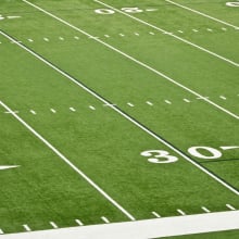 wide angle view of 30 yard line on a football field 