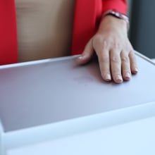 person unboxing a MacBook