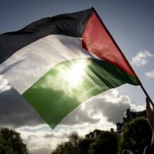 Protesters wave Palestinian flags during a rally in support of Palestinians in Amsterdam on October 15, 2023.