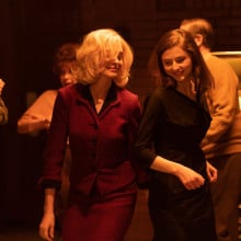 Anne Hathaway and Thomasin McKenzie dancing in "Eileen."