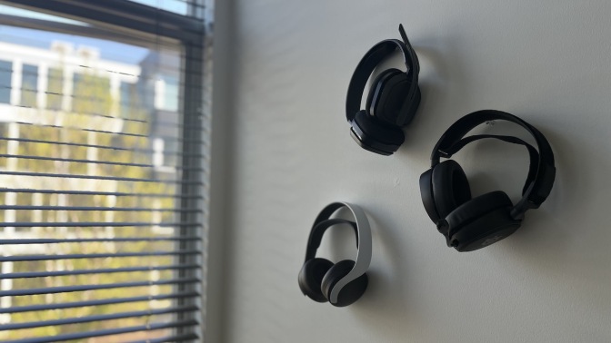 Picture of gaming headsets hanging on a wall