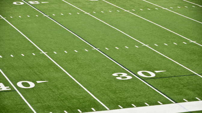 wide angle view of 30 yard line on a football field 