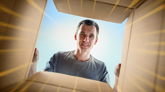 Man looking into a cardboard box