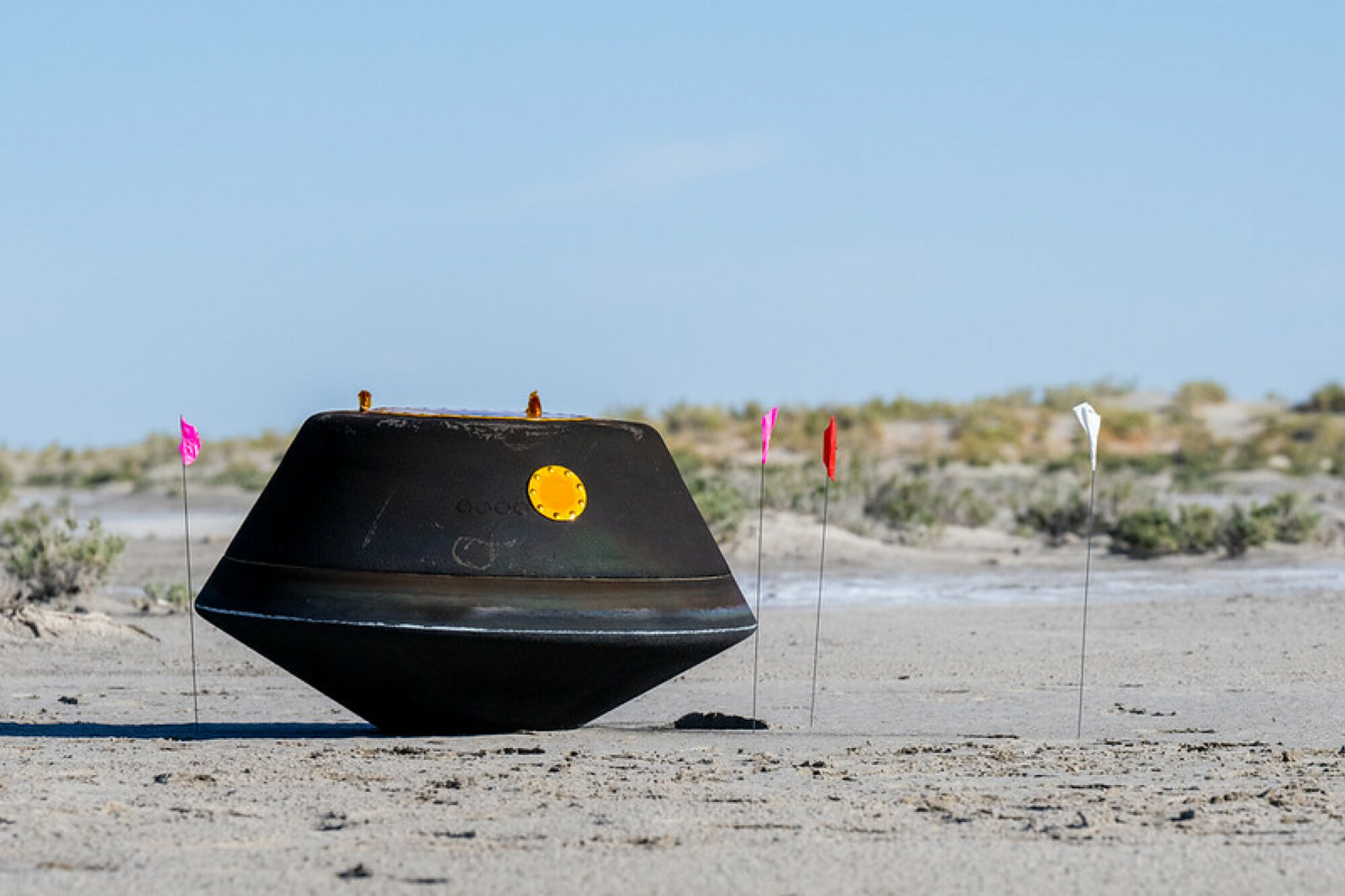 The charred OSIRIS-REx return capsule lying in the Utah desert on Sept. 24, 2023.