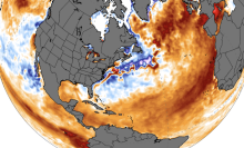 A globe showing anomalously warm temperatures in the Pacific and Atlantic oceans in mid-June 2023.