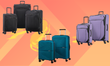 black, periwinkle, and teal luggage set against orange background