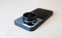 fisheye lens sitting overtop iphone back camera lenses