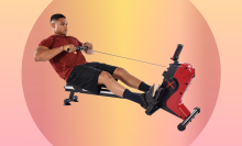 man using magnetic rower