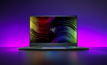 the razer blade 17 gaming laptop against a pink and purple gradient background