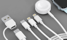 The 4-in-1 USB-C chargers shown laid out on a gray tabletop surface.