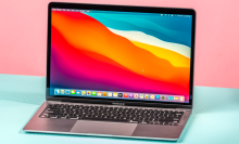the m1 apple macbook air from late 2020 against a pink and aqua background