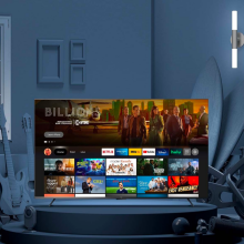 an amazon omni series tv displaying the prime video interface in a grayscale living room