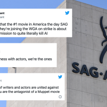 The SAG-AFTRA logo on the outside of its headquarters in LA. Screenshots of tweets from this article have been pasted around the logo.