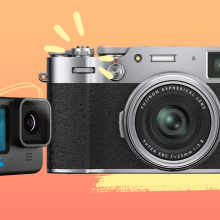 two cameras on yellow-orange background with accent marks