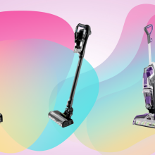 three bissell vacuum models against a pink background