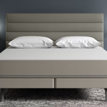 Sleep Number mattress and bed frame by nightstands and lamps