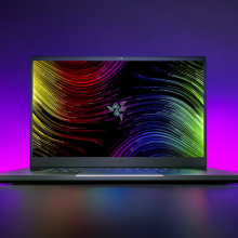 the razer blade 17 gaming laptop against a pink and purple gradient background