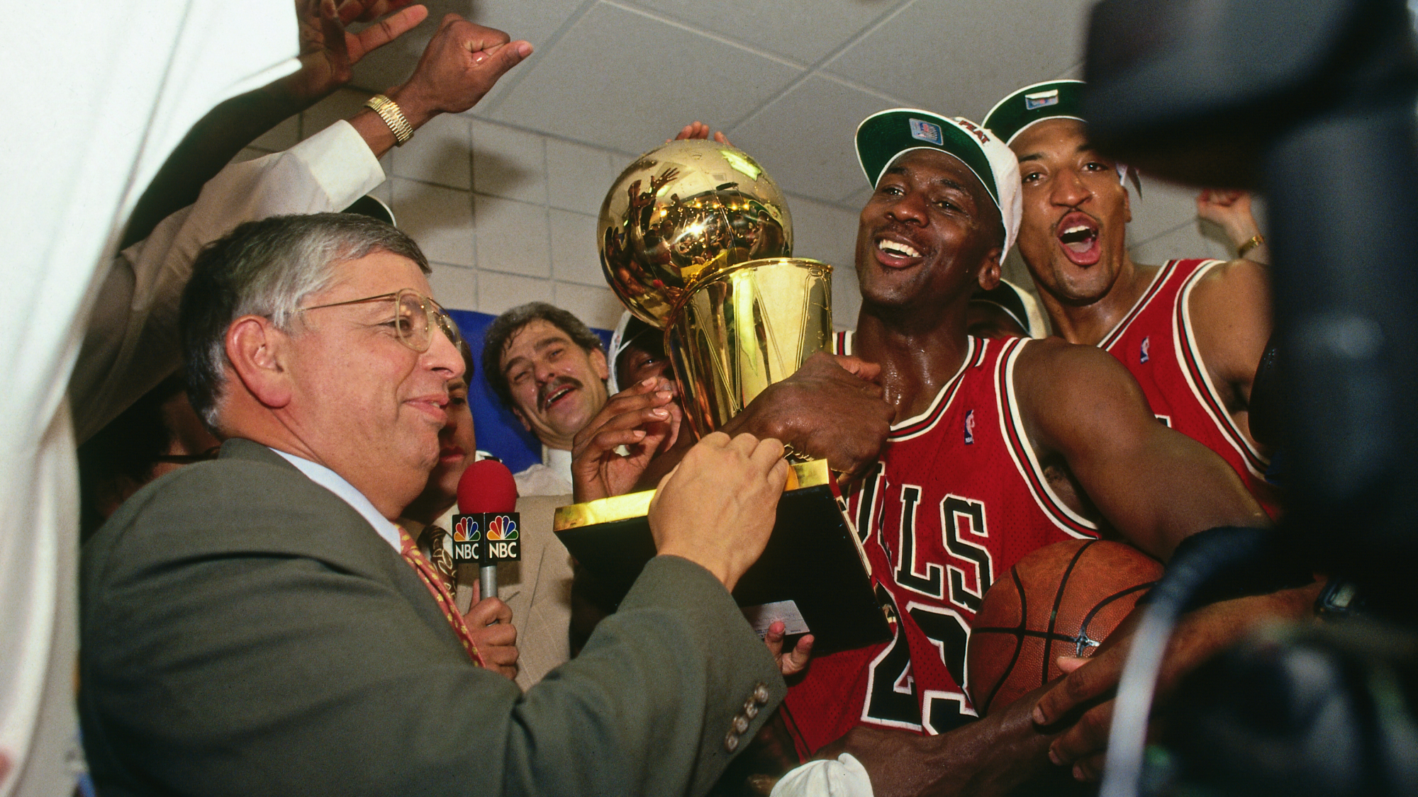 Michael Jordan and the Chicago Bulls in the dressing room celebrating victory.
