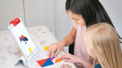 Kids playing with the Osmo Genius Kit.