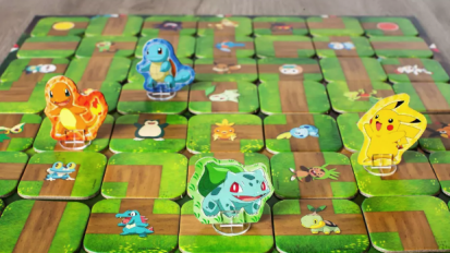 Pokémon board game with Pikachu, Charizard, Bulbasaur, and Squirtle game pieces on board